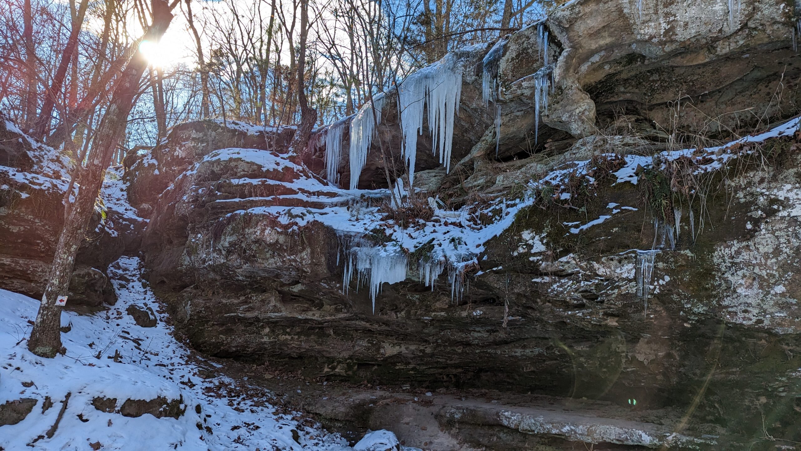 Icicles hang on a rock wall at Pickle Springs Natural Area