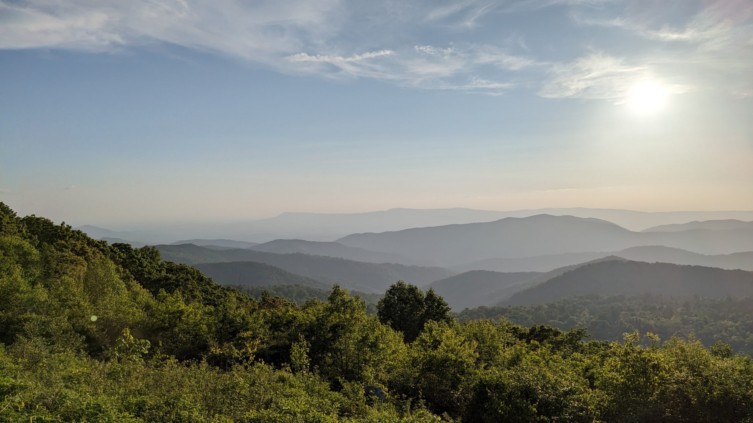 Mountains disappear into the fog in the distance